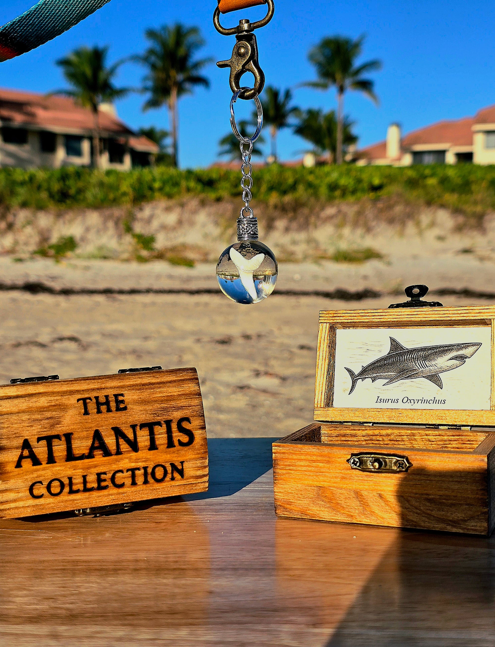 Atlantis Collection keychain in its wooden treasure chest packaging